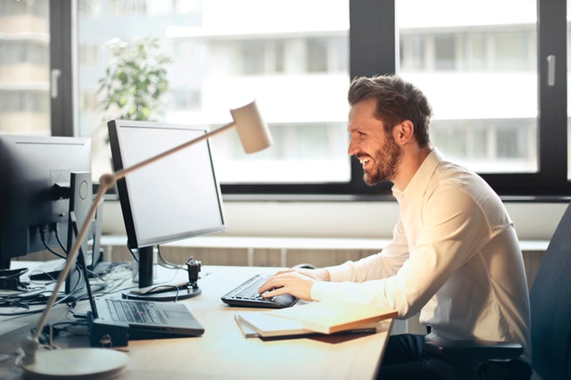 Man at computer, working remotely