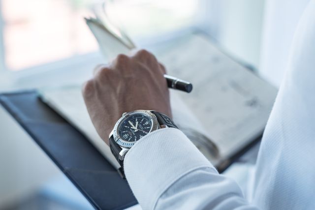 Businessman searching for a date in his diary